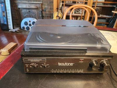 Boytone record player, with Bluetooth, radio, and auxiliary. Has built in speakers but can connect to a receiver. Works great.