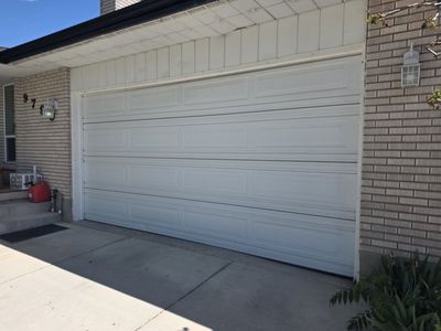 16 x 8 GARAGE DOOR WITH RAILS AND OPERATOR
