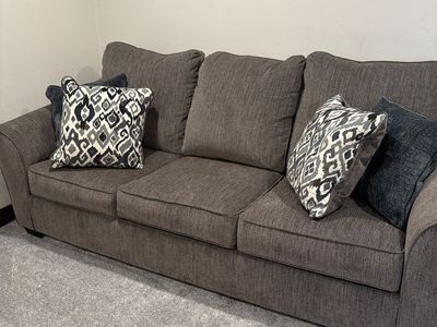 BRAND NEW ASHLEY!!! REDUCED ($700 obo) Grayish brown Fabric 3-Seater Sleeper Sofa - Great for Guest Rooms