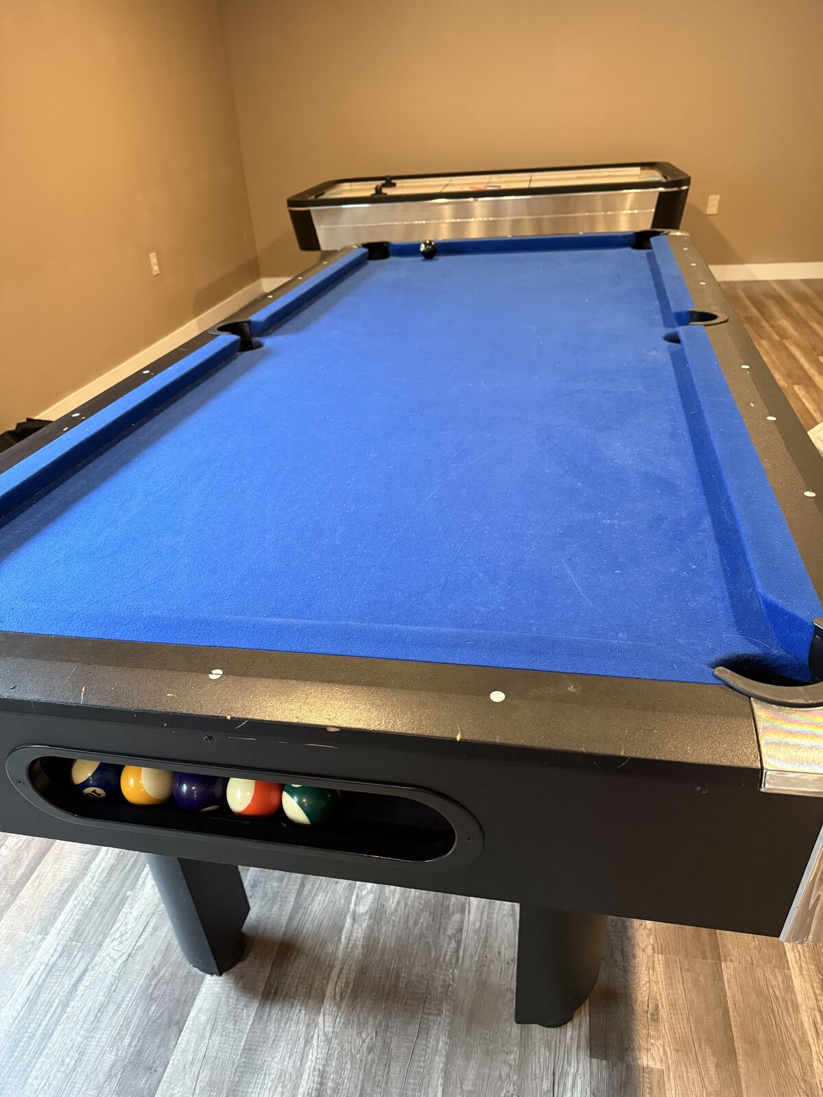 Pool table, cues, and billiard balls