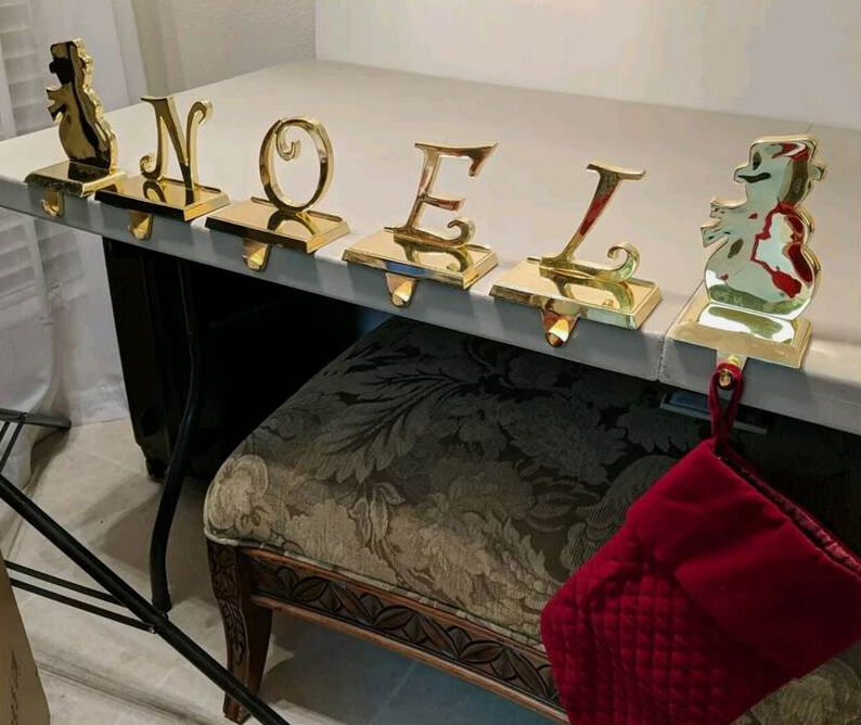 vintage NOEL gold colored letters / weighted mantle stocking hangers