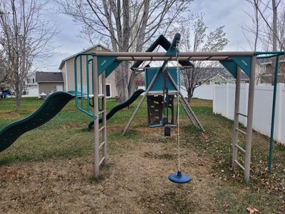 Lifetime Kid's Big Stuff Metal Swing Set with 2 Slides, Monkeybars, Climbing Wall, Rope Net Ladder
