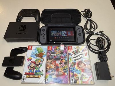 Nintendo Switch with Pro Controller and Four Games