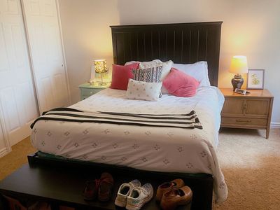 Black queen bed frame and bench with storage