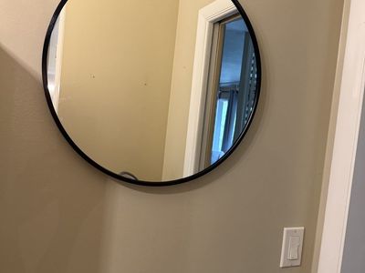 Round Wall Mirror with Black Frame - Modern Home Decor Accent. Measures 20”