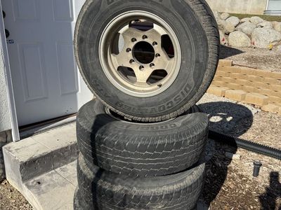 Set of 4 Cooper Discoverer AT3 265/75R16 Tires with Wheels - 8x6.5” (8x165.1mm)