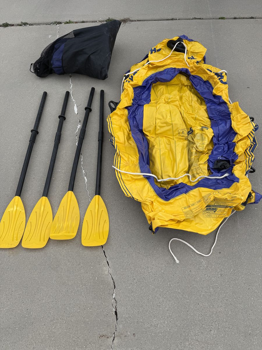 2 inflatable rafts and four oars