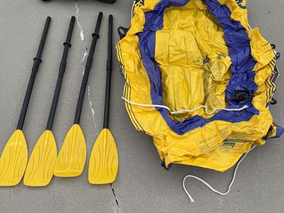 2 inflatable rafts and four oars