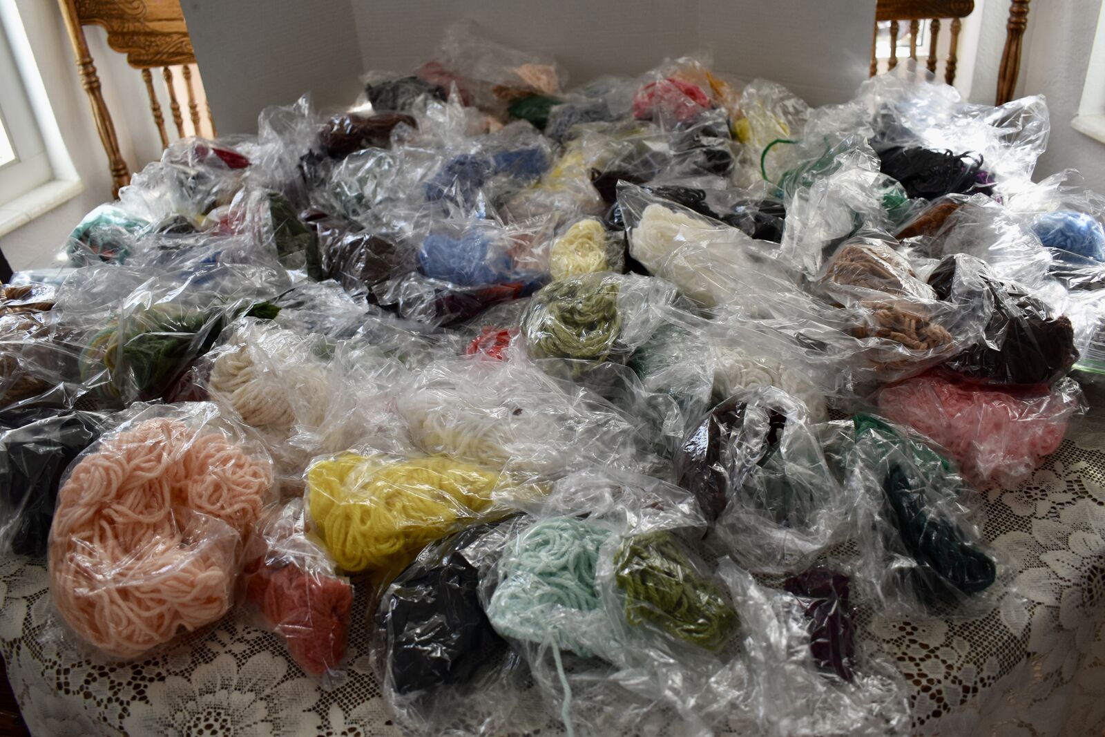 SEVERAL SMALL BAGGIES FILLED WITH LEFT OVER VINTAGE YARN FROM PREVIOUS CROCHET / CRAFT PROJECTS IN EACH PACKAGE