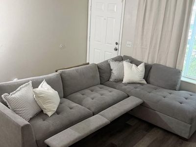 gray sectional couch with electric footrests