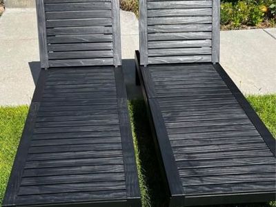 New Set of 2 Black Plastic Outdoor Chaise Lounges $50 for the pair.