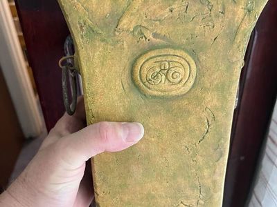 Decorative Distressed Vase with Metal Ring Handles and Medallion