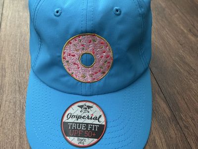 Sell or trade NEW golf hat with a pink donut embroidered blue adjustable