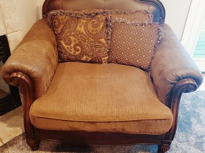 Ornate Brown Armchair with Decorative Pillows
