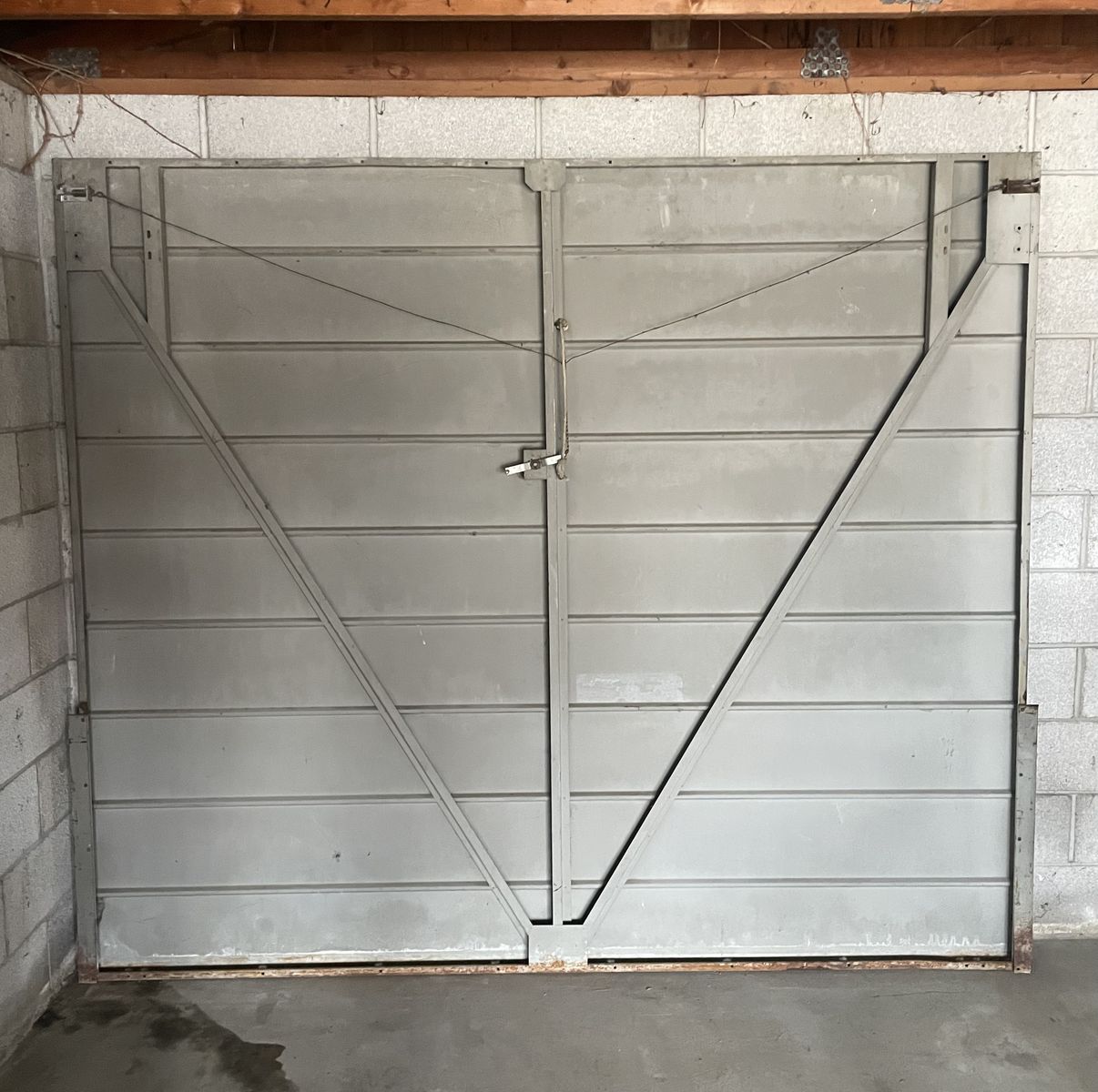 Vintage Single-Panel Tilt-up Metal Garage Door