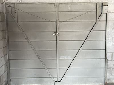 Vintage Single-Panel Tilt-up Metal Garage Door