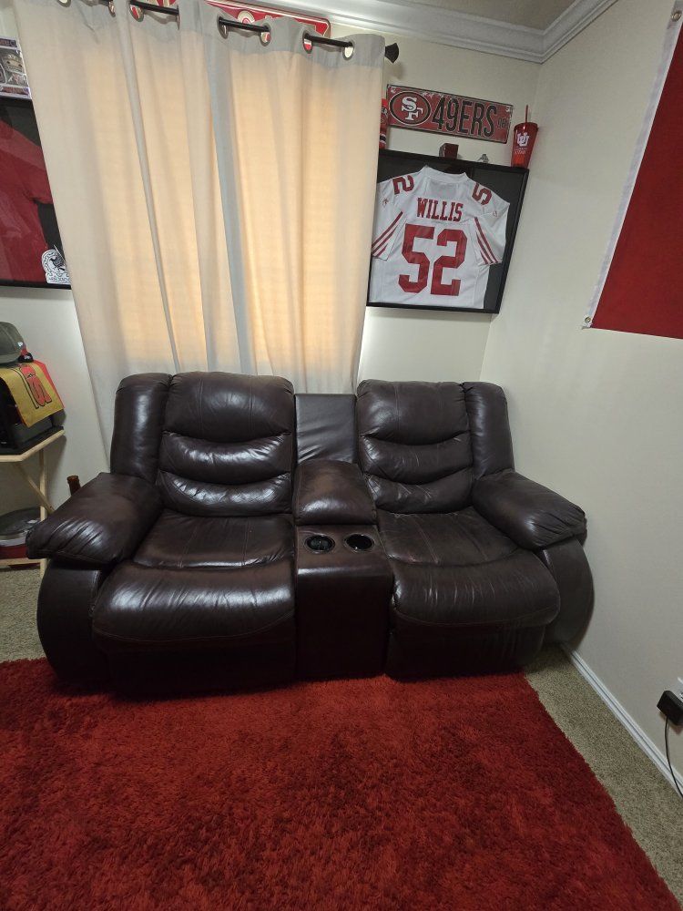 Brown Leather/vinyl  Reclining Loveseat with Center Console & Cup Holders