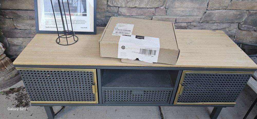 Grey TV stand with wood top