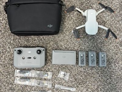DJI Mini 2 plus controller, 3 batteries, new blades, and more extras!