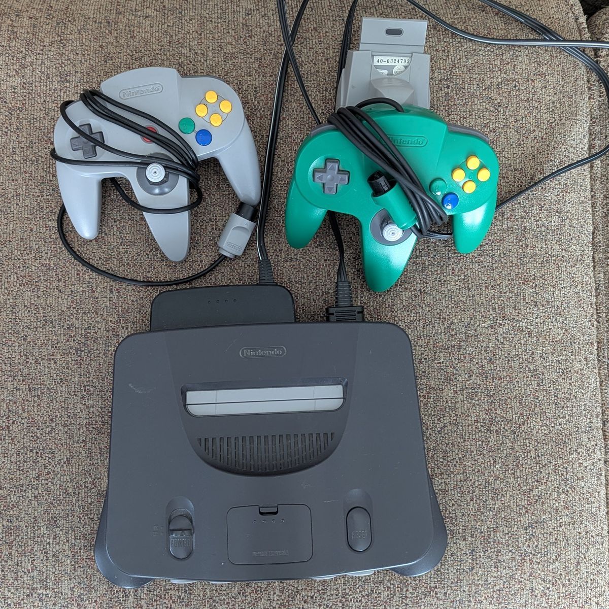Nintendo 64 w/two controllers, tremor pak, memory card, jumper pak