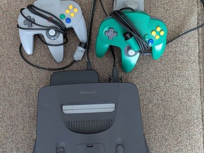 Nintendo 64 w/two controllers, tremor pak, memory card, jumper pak