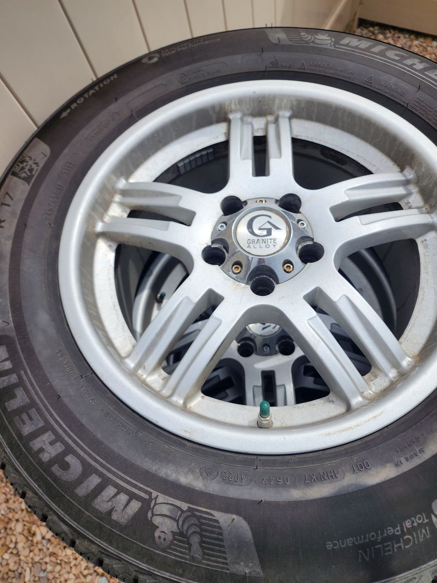 4 Michelin X-Ice Snow Tires on Rims