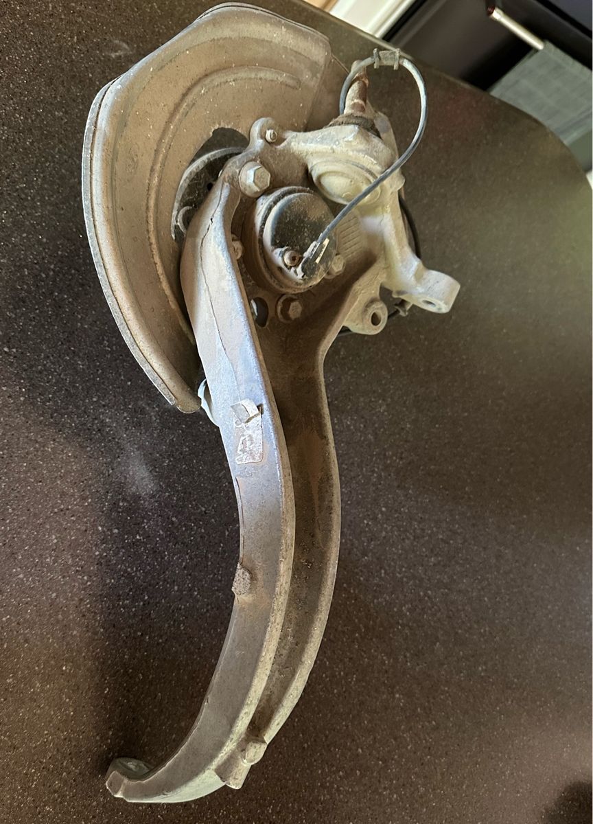 Used Steering Knuckle Assembly with Hub and Dust Shield for a 2004 Ford Thunderbird 