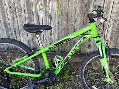Specialized 24” wheel Hotrock Mtn bike w front shock, shifts and brakes great. New shifter, grips, & tubes just installed.