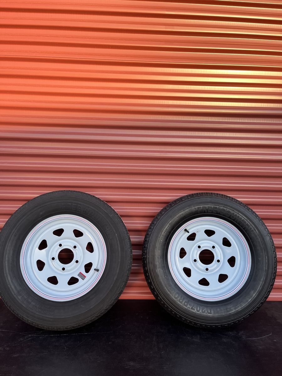 Set of 2 Free Country ST 205/75 R 15” Trailer Tires Mounted on New White Spoke Wheels 10 Ply E Load 5 on 5.      Brand New