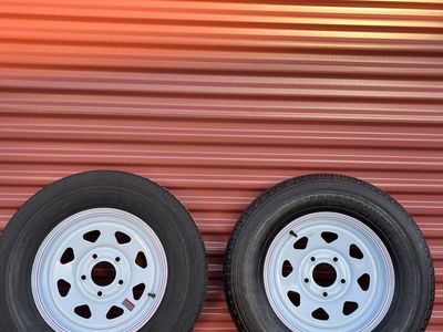 Set of 2 Free Country ST 205/75 R 15” Trailer Tires Mounted on New White Spoke Wheels 10 Ply E Load 5 on 5. Brand New