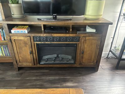 TV stand with built-in fireplace and storage