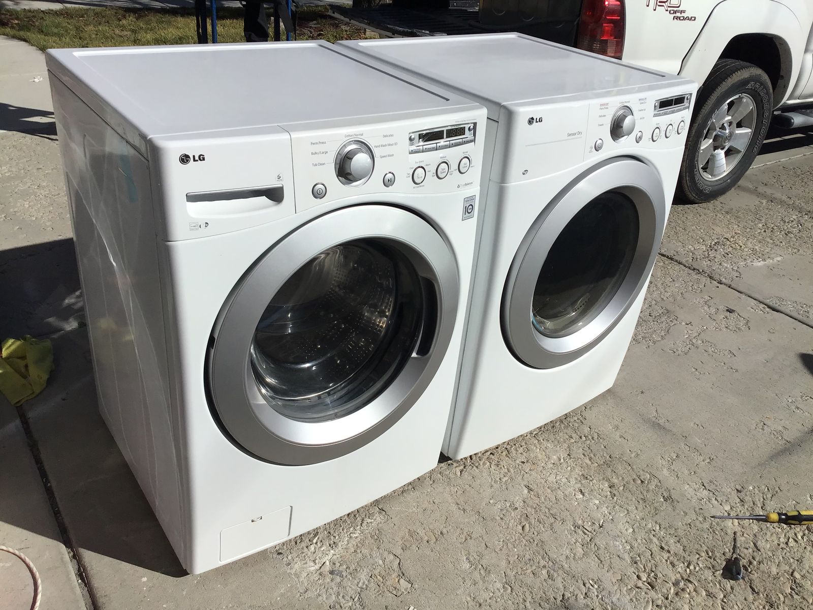 NICE STACKABLE SIDE/SIDE LG SUPER CAPACITY FRONT LOAD WASHER AND DRYER INCLUDES FREE DELIVERY PLUS HOSES