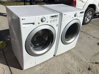NICE STACKABLE SIDE/SIDE LG SUPER CAPACITY FRONT LOAD WASHER AND DRYER INCLUDES FREE DELIVERY PLUS HOSES