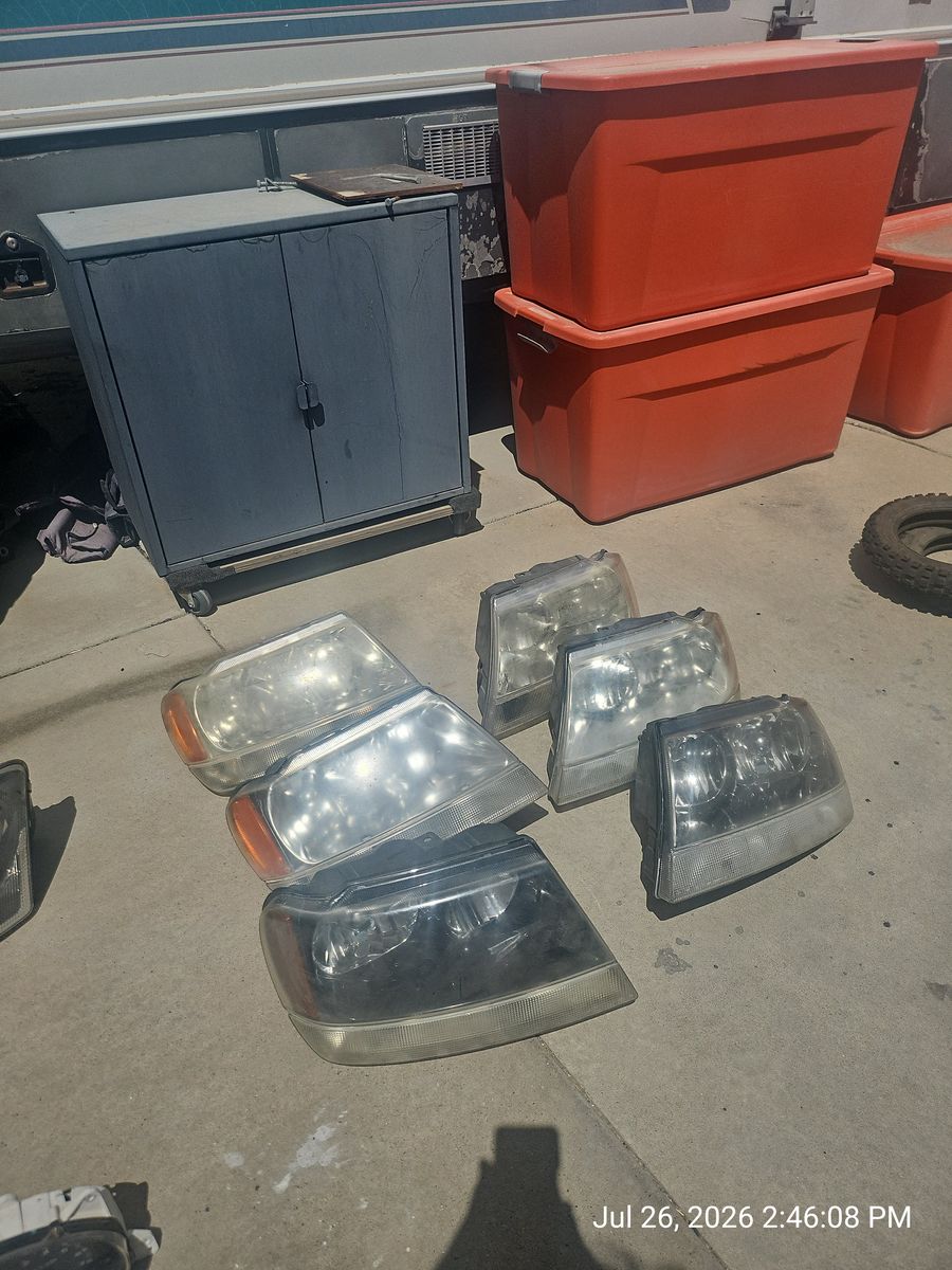 6 Used Jeep Grand Cherokee Head lights and 4 Chrysler Pacifica