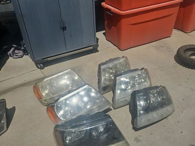 6 Used Jeep Grand Cherokee Head lights and 4 Chrysler Pacifica