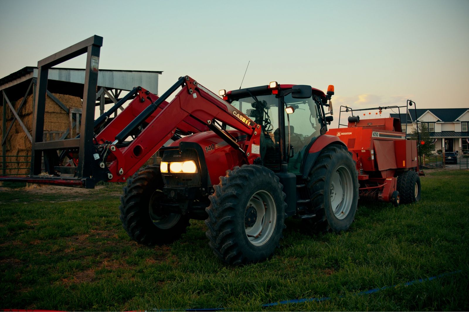 Case IH Maxxum 140 Tractor with Front Loader and Heston 4750 3x3 baler. 