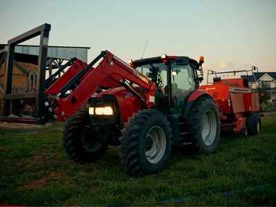 Case IH Maxxum 140 Tractor with Front Loader and Heston 4750 3x3 baler.