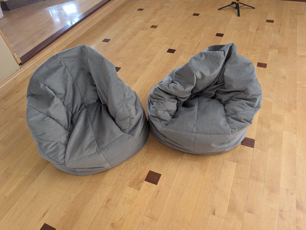 2 gray bean bag chairs