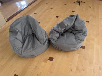 2 gray bean bag chairs