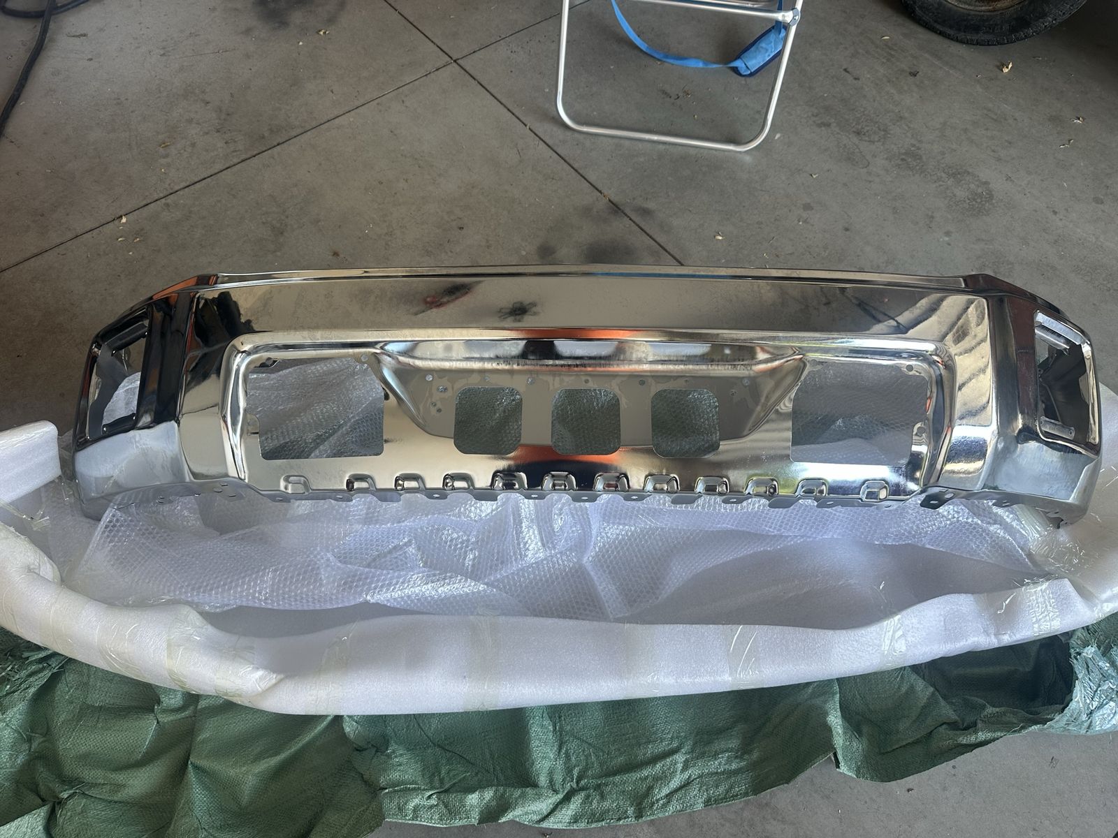 chrome front bumper for 2014-2015 GMC Sierra 1500 trucks.