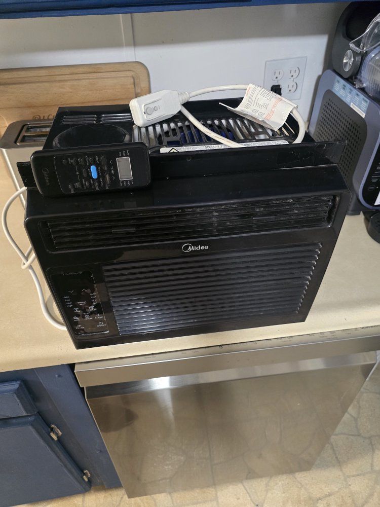 Black Window Air Conditioner Unit with Remote Control used last summer been sitting in storage