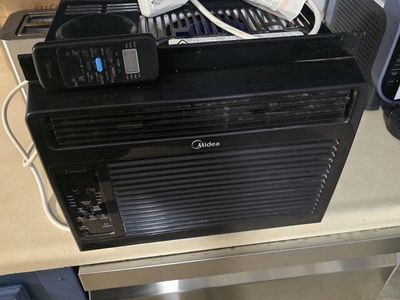 Black Window Air Conditioner Unit with Remote Control used last summer been sitting in storage