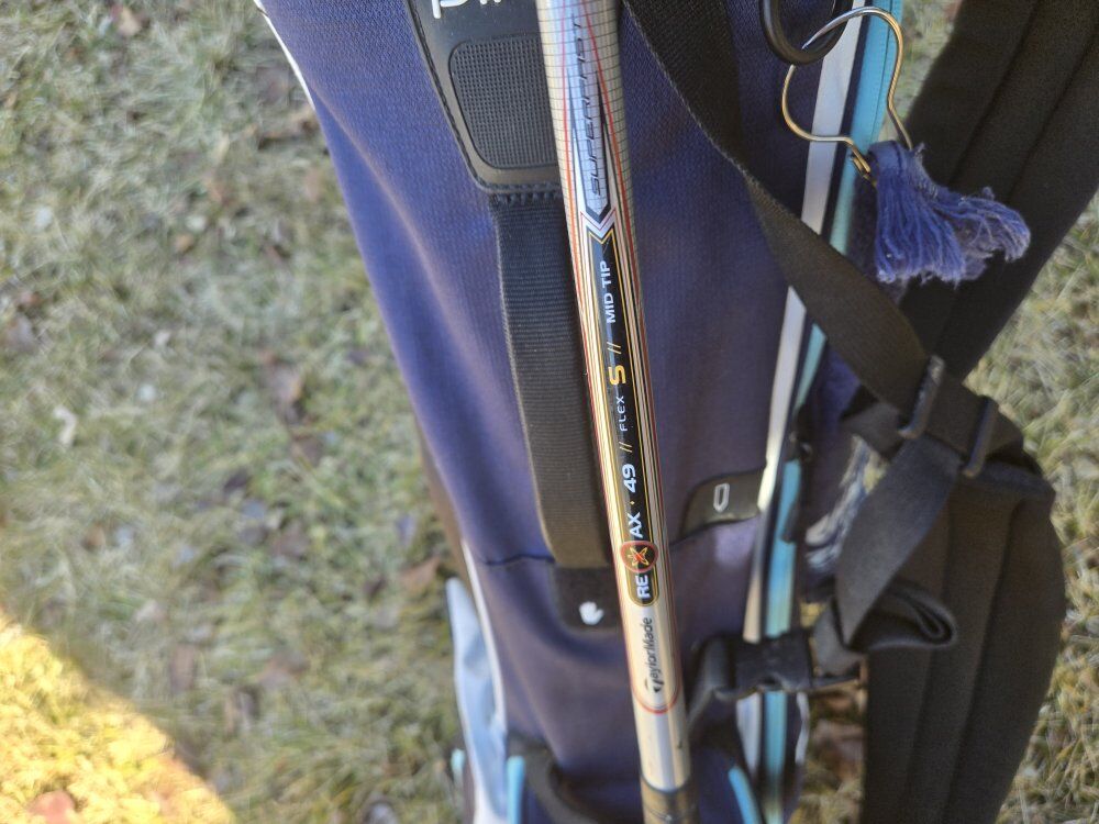 Golf bag with clubs and irons