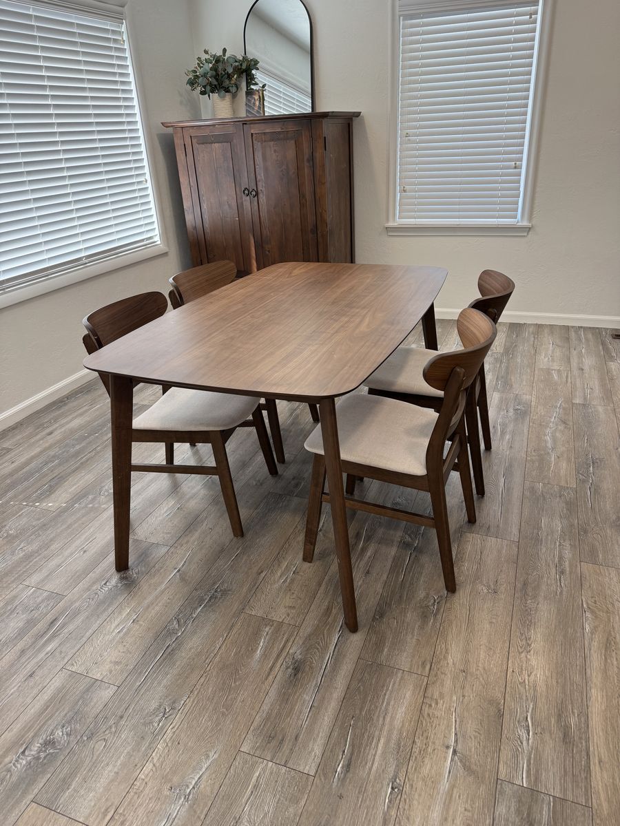 Walnut dining table with upholstered chairs
