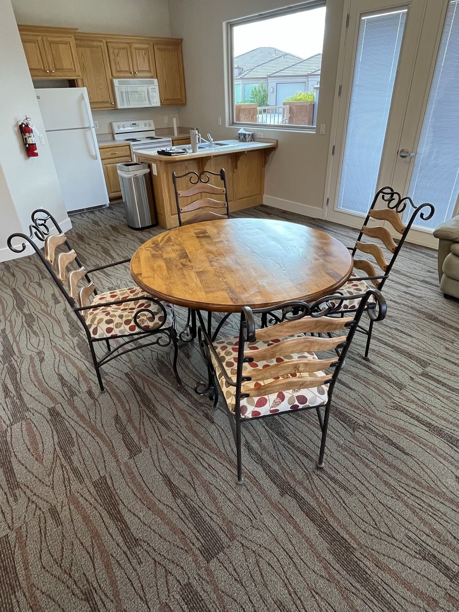 Dining table and 6 wrought iron padded chairs