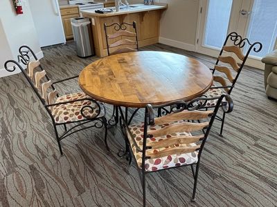 Dining table and 6 wrought iron padded chairs