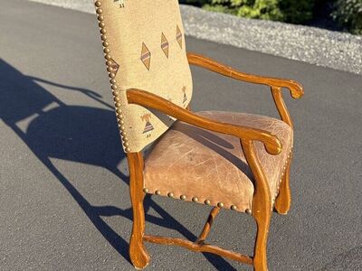 Fantastic vintage arm chair. Genuine leather seat and hand woven Persian wool upholstery fabric