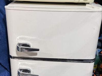 Compact ivory Top Freezer Refrigerator with Chrome Handles - Ideal for Small Spaces and Microwave (not pictured)