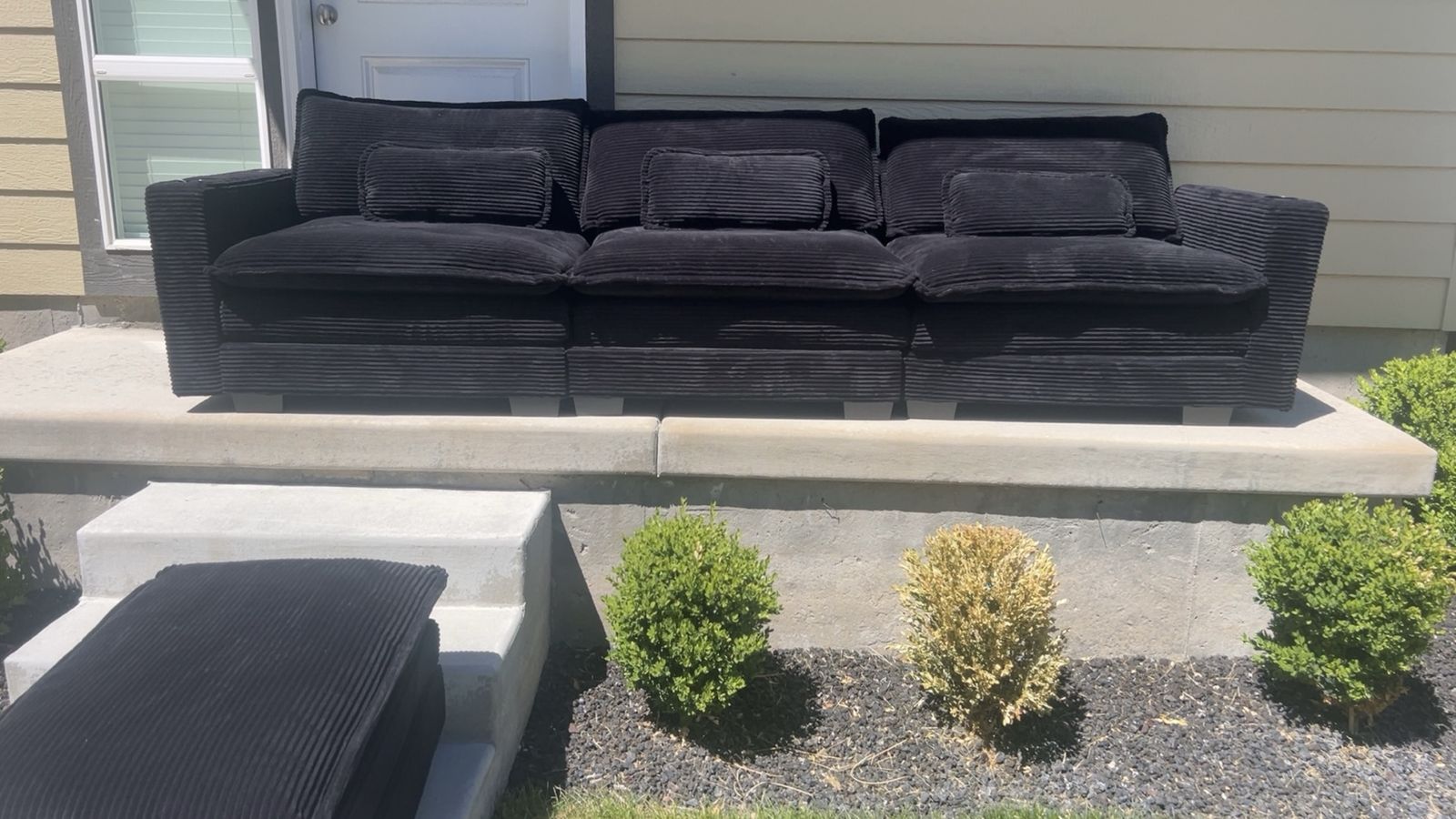 Black plush couch + ottoman