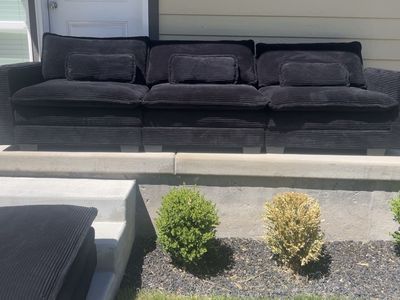 Black plush couch + ottoman